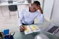 Worried Businessman Writing Schedule In The Diary Royalty Free Stock Photo