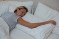 Overhead woman sleeping peacefully on bed