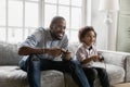 Overjoyed African American father with son playing video game Royalty Free Stock Photo