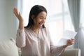 Overjoyed African American woman read good news in letter Royalty Free Stock Photo