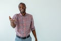 Overjoyed afro american man standing against white background Royalty Free Stock Photo