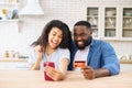 Hilarious African-American couple shopping at home Royalty Free Stock Photo