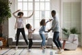 Overjoyed biracial family with kids have fun dancing Royalty Free Stock Photo