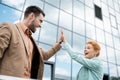 overjoyed business partners giving high five