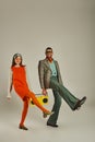 overjoyed couple in stylish retro attire