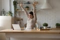 Overjoyed crazy freelancer girl getting great happy news at laptop