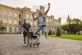 Overjoyed disabled handicapped mature man can walk again. Recovering patient jumping up from his wheelchair, young nurse Royalty Free Stock Photo