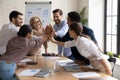 Excited diverse employees give high five at meeting Royalty Free Stock Photo