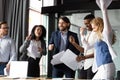 Overjoyed diverse coworkers celebrating corporate financial success. Royalty Free Stock Photo