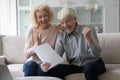 Overjoyed elderly couple relish moment of great unbelievable news Royalty Free Stock Photo