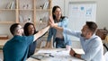 Overjoyed employees team giving high five, celebrating success Royalty Free Stock Photo