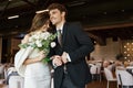 overjoyed groom smiling near young charming