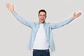 Overjoyed happy man standing with his hands wide open Royalty Free Stock Photo