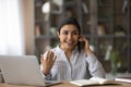 Overjoyed Indian woman talking on phone, hearing good news Royalty Free Stock Photo