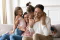 Overjoyed little children playing with happy parents.