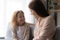 Overjoyed little girl with mother having fun at home Royalty Free Stock Photo