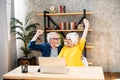 Older couple looks on laptop with a winery smiles Royalty Free Stock Photo