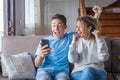 Overjoyed middle age woman and young man looking at laptop screen, reading good news in email, showing yes gesture, elderly mother Royalty Free Stock Photo