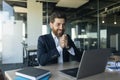 Overjoyed middle aged businessman celebrating great news, looking at laptop screen in joy, sitting at desk in office Royalty Free Stock Photo