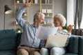 Happy elderly spouses clients excited with easy online payment