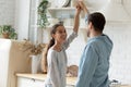 Happy young couple dancing in modern kitchen at home Royalty Free Stock Photo