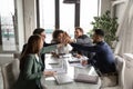 Excited diverse employees engaged in teambuilding activity at meeting Royalty Free Stock Photo