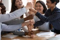 Overjoyed multiracial people stack fists at meeting Royalty Free Stock Photo