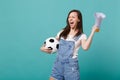 Overjoyed screaming young woman football fan support favorite team with soccer ball, megaphone isolated on blue Royalty Free Stock Photo