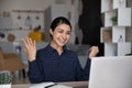 Overjoyed surprised Indian woman looking at laptop screen, reading news