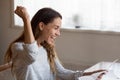 Overjoyed woman rejoicing achievement, reading good news in letter