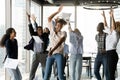 Overjoyed young african american colleagues dancing in modern office. Royalty Free Stock Photo