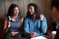 Overjoyed young African American couple celebrating, making successful deal Royalty Free Stock Photo