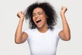 Overjoyed young african american woman screaming with joy celebrating victory Royalty Free Stock Photo