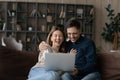 Happy Caucasian couple rest at home using laptop Royalty Free Stock Photo