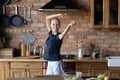 Happy young sick woman dancing in home kitchen