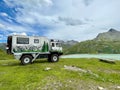 Overland truck at Silvretta reservoir, Vorarlberg, Austria.