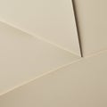 Overlapping beige paper sheets create geometric patterns with varying angles and lin Royalty Free Stock Photo