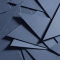 Overlapping dark blue paper triangles create an intricate, geometric pattern. Royalty Free Stock Photo