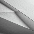 Overlapping sheets of paper create abstract geometric patterns. The paper has a Royalty Free Stock Photo
