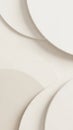 Overlapping smooth curved shapes in soft neutral beige and cream tones, creating a minimalist abstract background with subtle Royalty Free Stock Photo