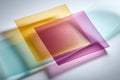 Overlapping translucent colored acrylic sheets on white background Royalty Free Stock Photo