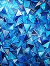 An abstract pattern of overlapping triangular shards in various blue hues Royalty Free Stock Photo