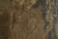 Overlay for your design with space to copy. Brown marble stone of rough texture. Brown texture of concrete, stone wall Royalty Free Stock Photo