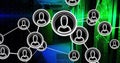 Overlaying stylized user icon network over data center with server racks and LED light panels Royalty Free Stock Photo