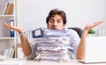 Overloaded busy employee with too much work and paperwork