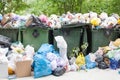 Overloaded dumpster, full garbage container, household garbage bin, trash can, heap of unsorted rubbish, pile of refuse, litter Royalty Free Stock Photo