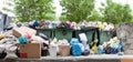 Overloaded dumpster, full garbage container, household garbage bin, trash can, heap of unsorted rubbish, pile of refuse, litter Royalty Free Stock Photo