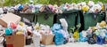 Overloaded dumpster, full garbage container, household garbage bin, trash can, heap of unsorted rubbish, pile of refuse, litter Royalty Free Stock Photo