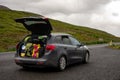 Overloaded station wagon car with luggage and bags