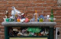 Overloaded trash can at the end of the day in Venice, Italy